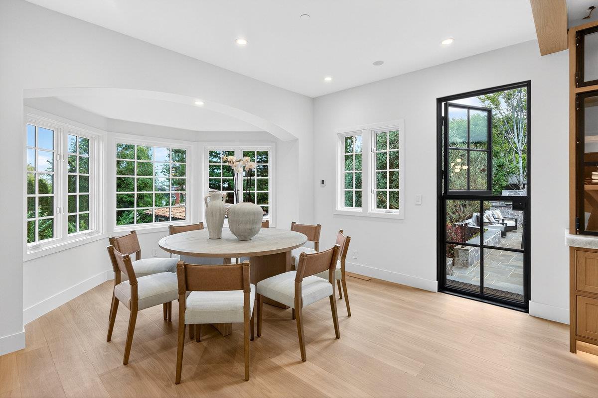 Modern dining room with light oak hardwood floors